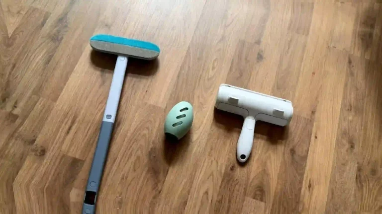 Three types reusable pet hair remover tools laid on wooden floor, home lint cleaners